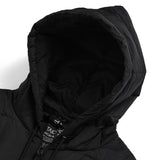 Close-up of a black hooded jacket with a brand label on a white background
