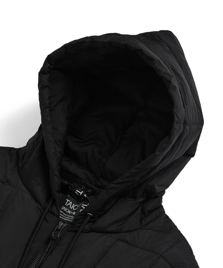 Close-up of a black hooded jacket with a brand label on a white background