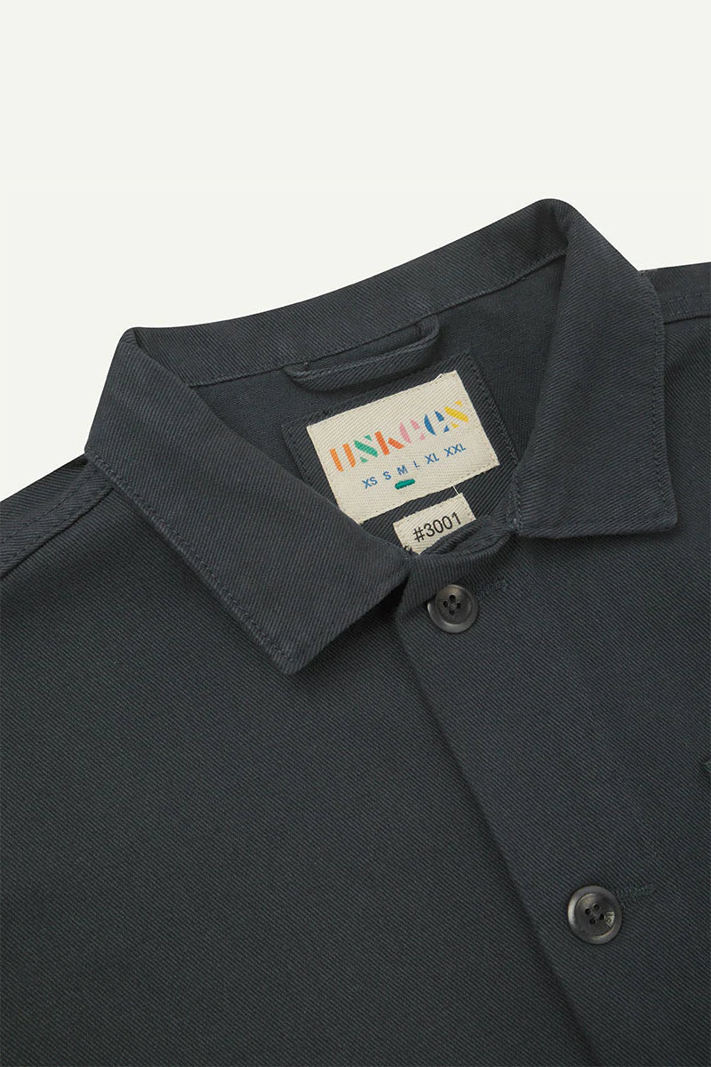 Dark gray jacket with a brand label on a light gray background