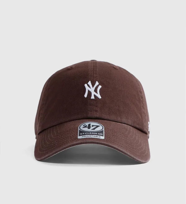Brown baseball cap with a logo on a light gray background