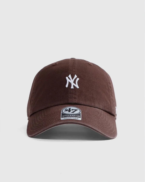 Brown baseball cap with a logo on a light gray background