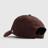 Brown baseball cap on a light gray background