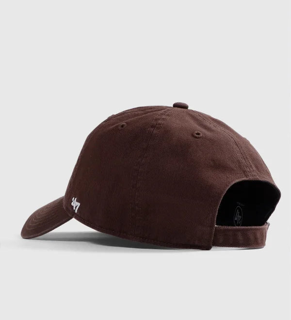 Brown baseball cap on a light gray background