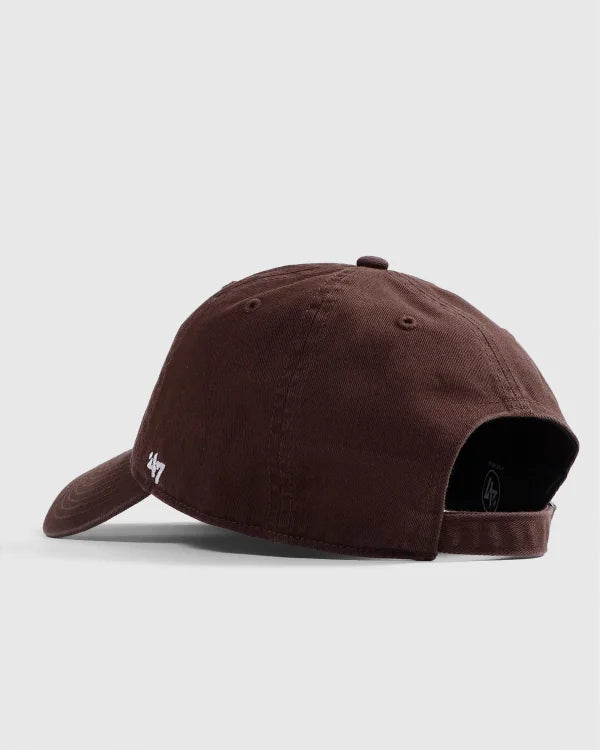 Brown baseball cap on a light gray background