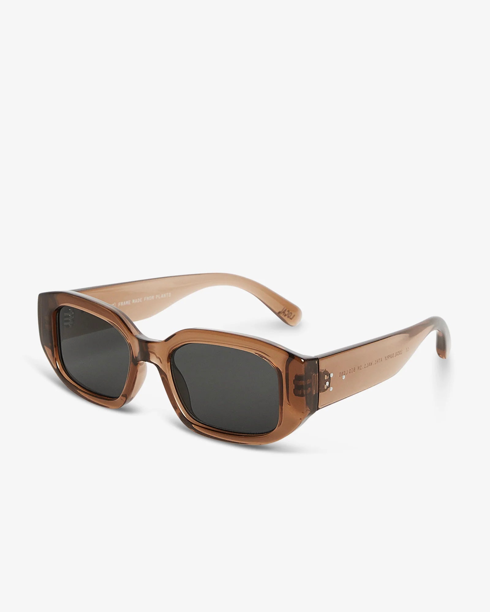 Brown sunglasses with dark lenses on a white background