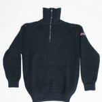 Blue half-zip sweater with a small logo on the sleeve against a white background