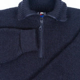 Dark Blue zip-up sweater with a brand label on a light gray background
