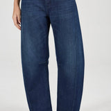 Person wearing blue jeans on a white background