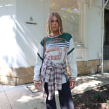 Person wearing a Printed Long sleeve Jersey and dark jeans with plaid shirt around waiste