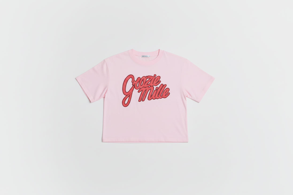 Woman wearing a pink 'Gottie Miller' t-shirt and red checkered shorts on a white background