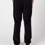 Person wearing black pants on a white background
