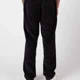 Person wearing black pants on a white background