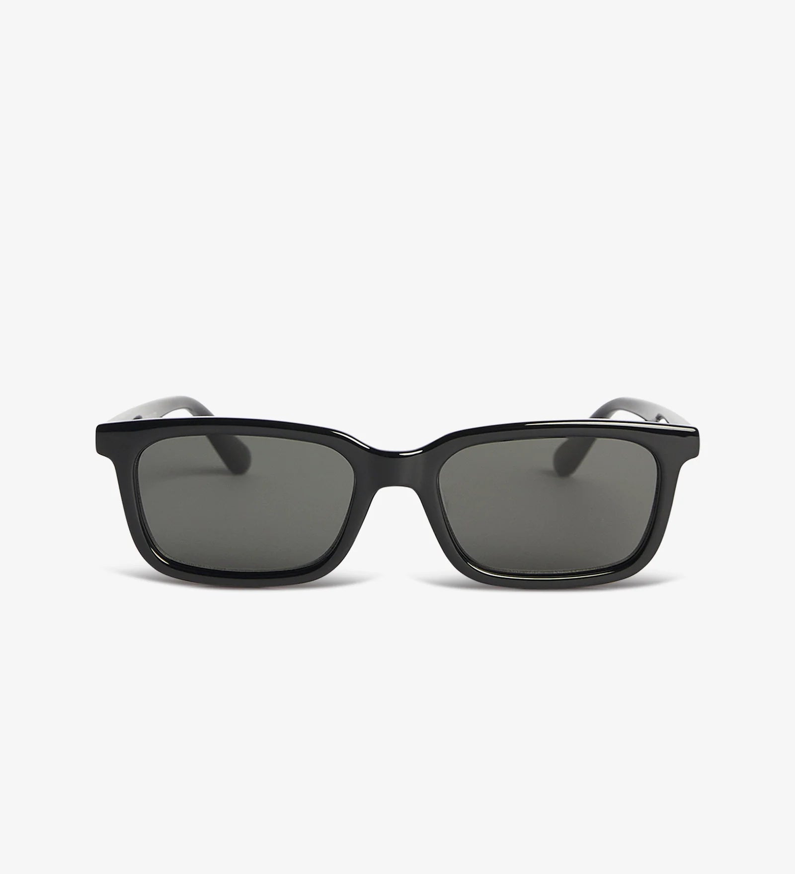 Black sunglasses with dark lenses on a white background