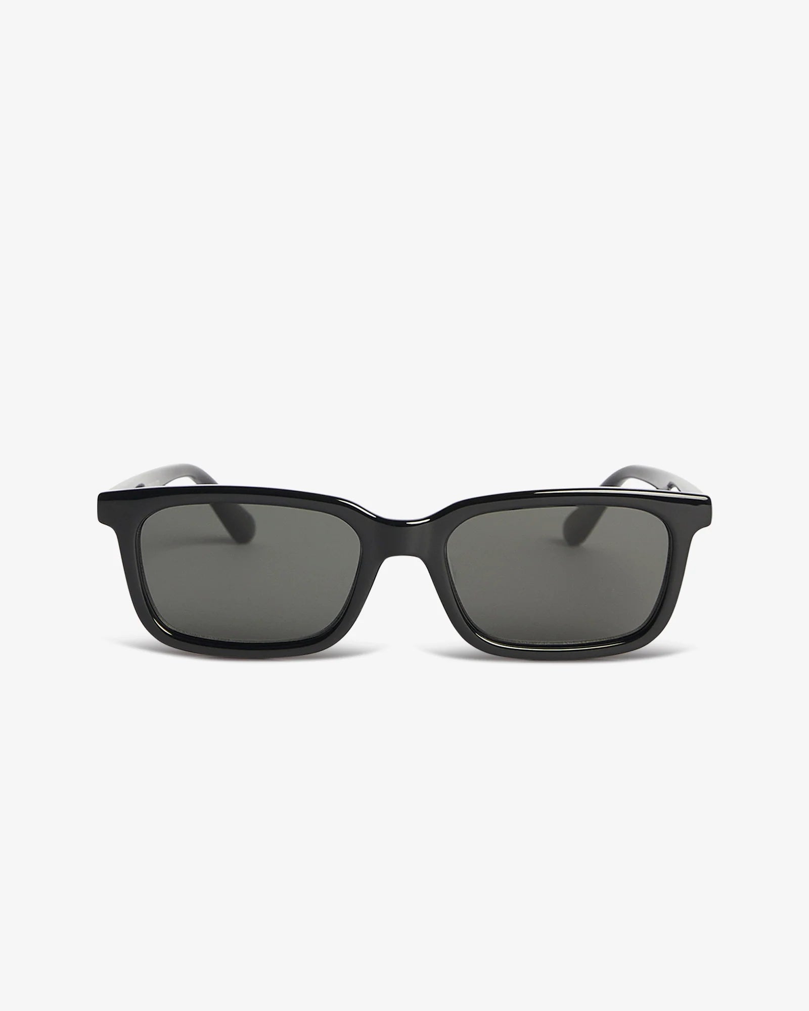 Black sunglasses with dark lenses on a white background