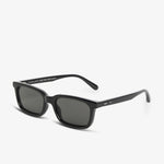 Black sunglasses with dark lenses on a white background