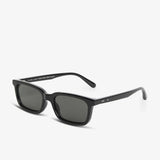 Black sunglasses with dark lenses on a white background