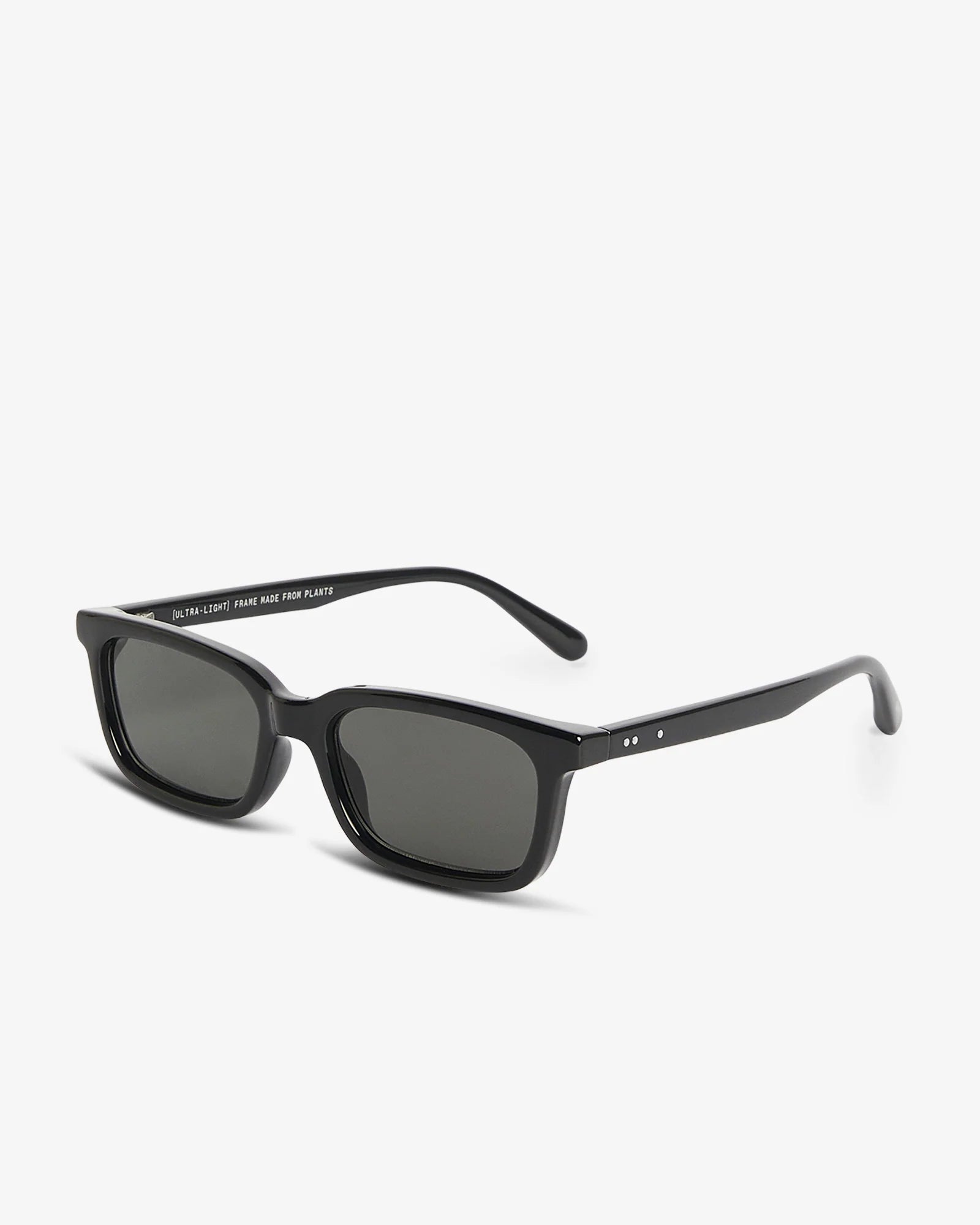 Black sunglasses with dark lenses on a white background