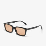 Sunglasses with black frame and brown lenses on a white background