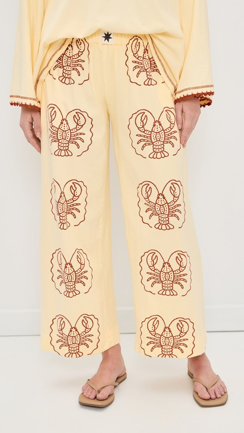 Person wearing Yellow Pants with Lobster print