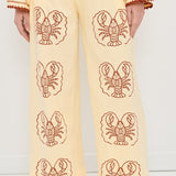 Person wearing Yellow Pants with Lobster print