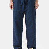 Person wearing navy blue pants on a white background