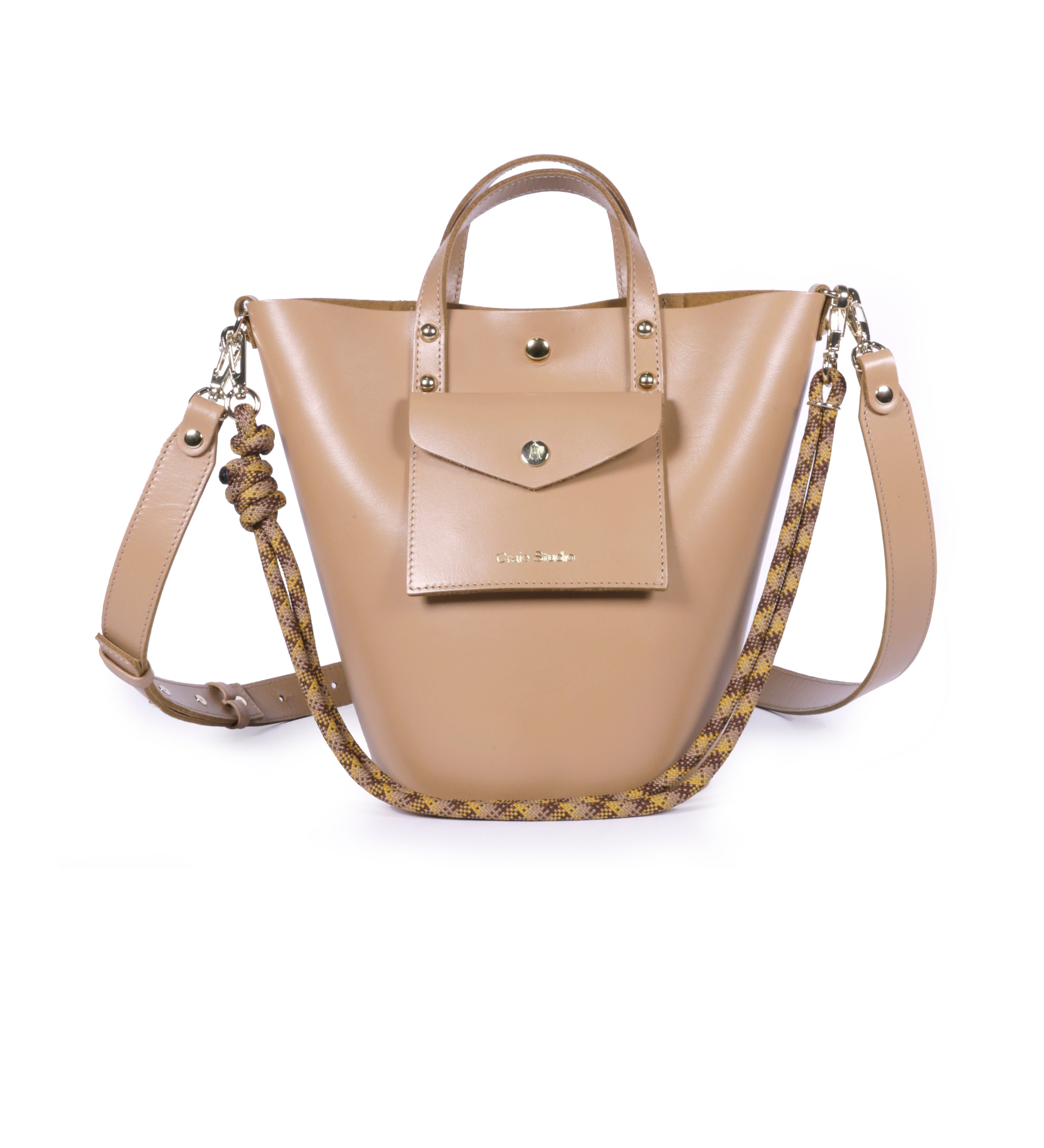 A mocha brown leather bucket bag with two shoulder straps and small leather handles. The bag is empty and displayed against a plain background.