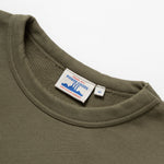 Green sweatshirt with a visible brand label on a white background