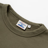 Green sweatshirt with a visible brand label on a white background