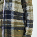 Plaid shirt with a visible brand label on a white background