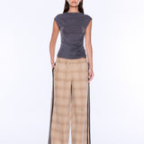 A model is shown from the back wearing a dark gray sleeveless top and beige plaid wide-leg pants with black side stripes, set against a plain white studio background.