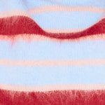 Close-up of a sweater with red, pink, and light blue stripes.