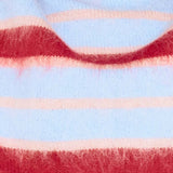 Close-up of a sweater with red, pink, and light blue stripes.