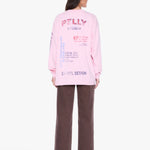 A model shown from the back wearing a light pink sweatshirt with colorful graphic text and dark brown wide-leg pants, photographed against a clean white background.