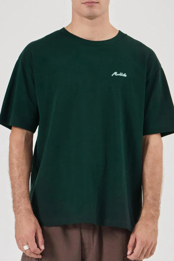 Person wearing a dark green t-shirt with a logo on a white background