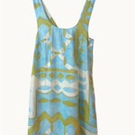 Blue and green patterned dress on a white background