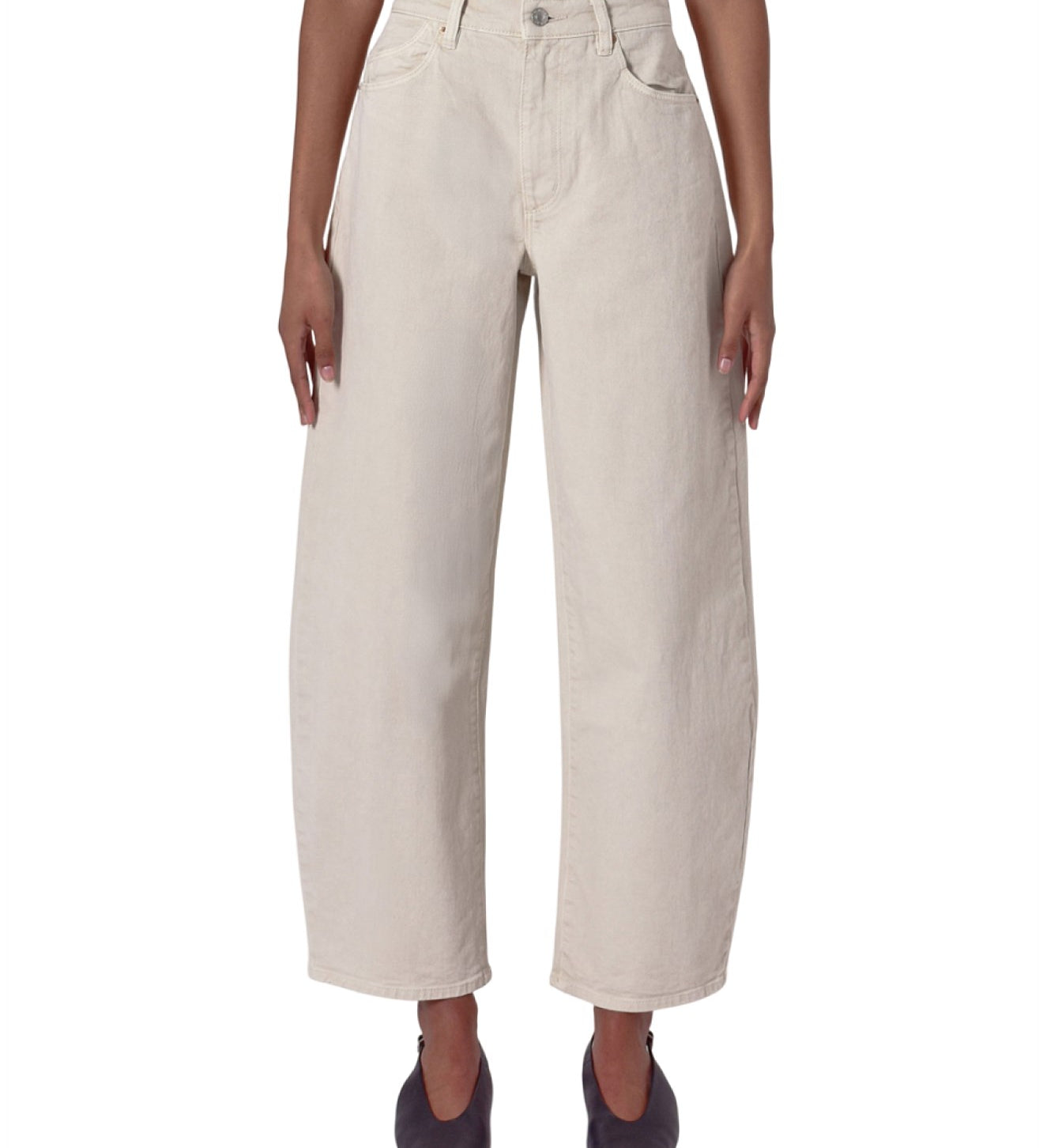 Beige wide-leg pants worn by a person on a white background