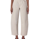 Beige wide-leg pants worn by a person on a white background
