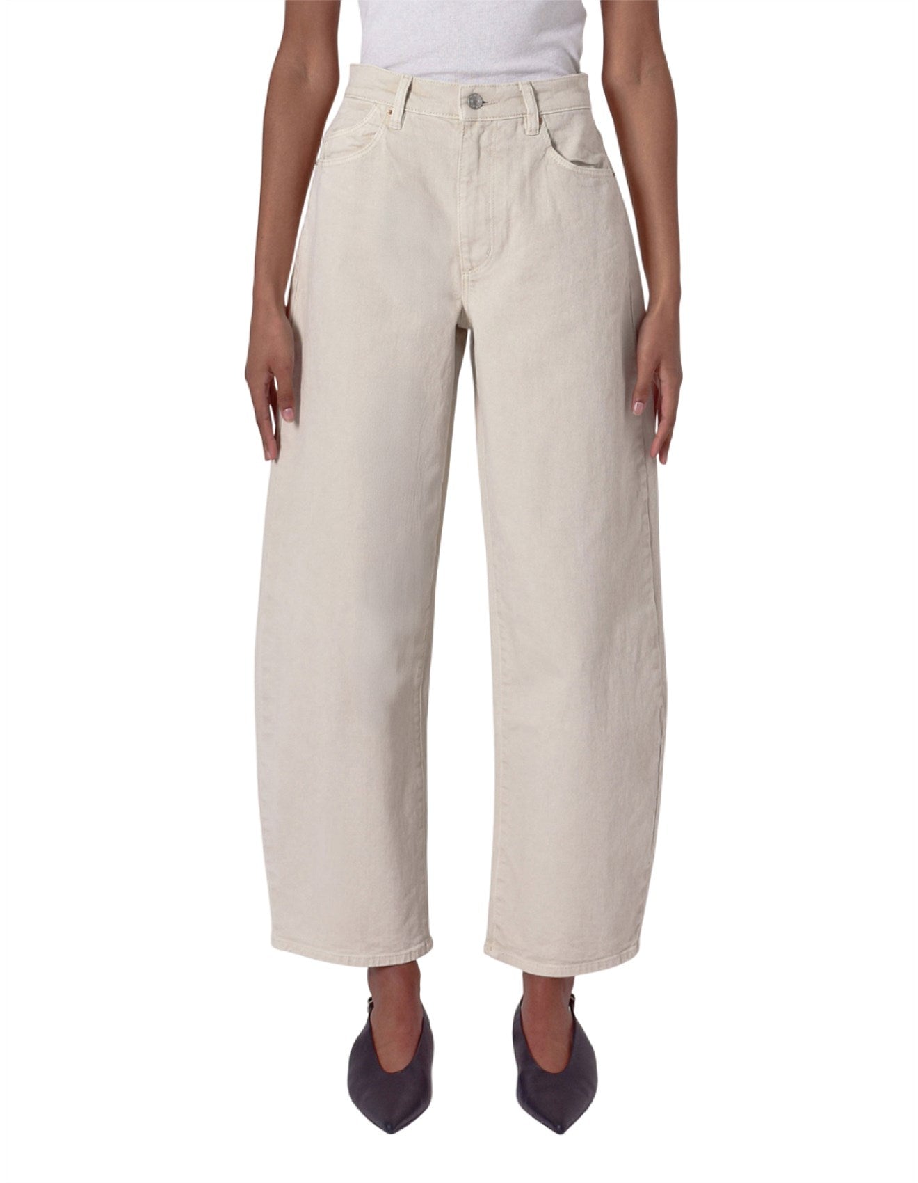 Beige wide-leg pants worn by a person on a white background