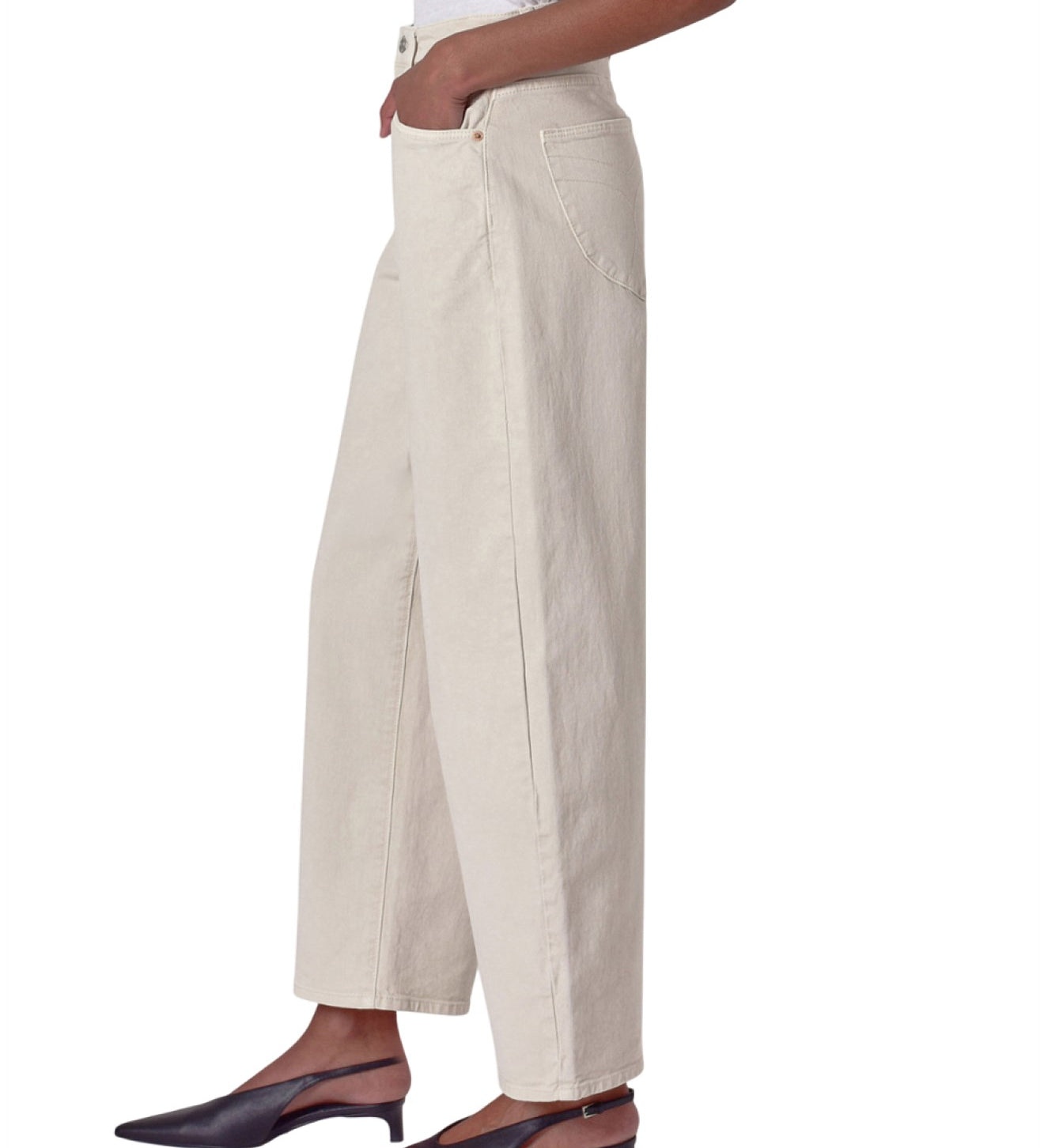 Person wearing beige wide-leg pants on a white background