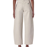Beige wide-leg pants worn by a person on a white background