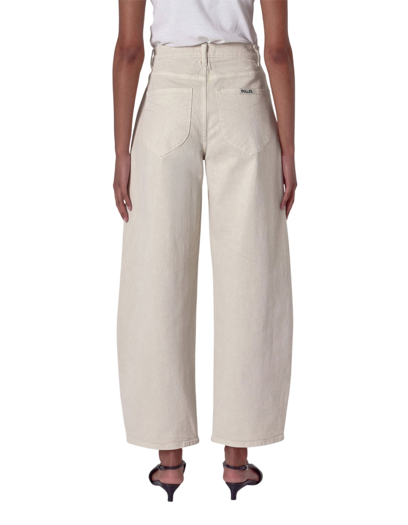 Beige wide-leg pants worn by a person on a white background