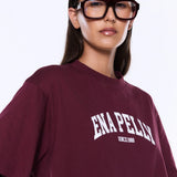 Person wearing a maroon t-shirt with 'ENAPELLY' branding on a white background