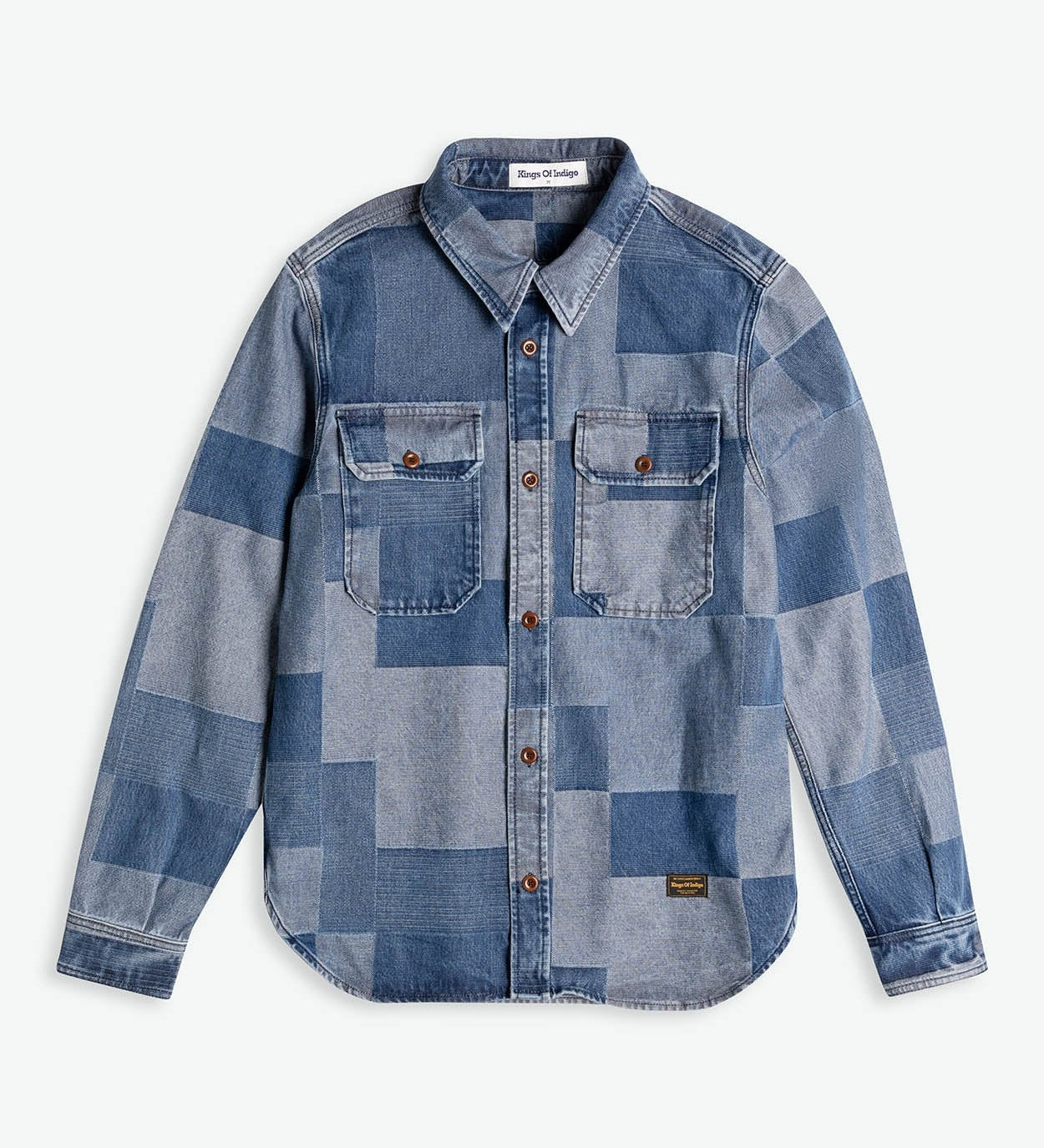 Blue patchwork denim shirt on a white background