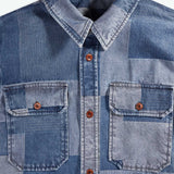 Blue denim shirt with patchwork pattern and button details, brand 'Kingdom of Indigo' visible.