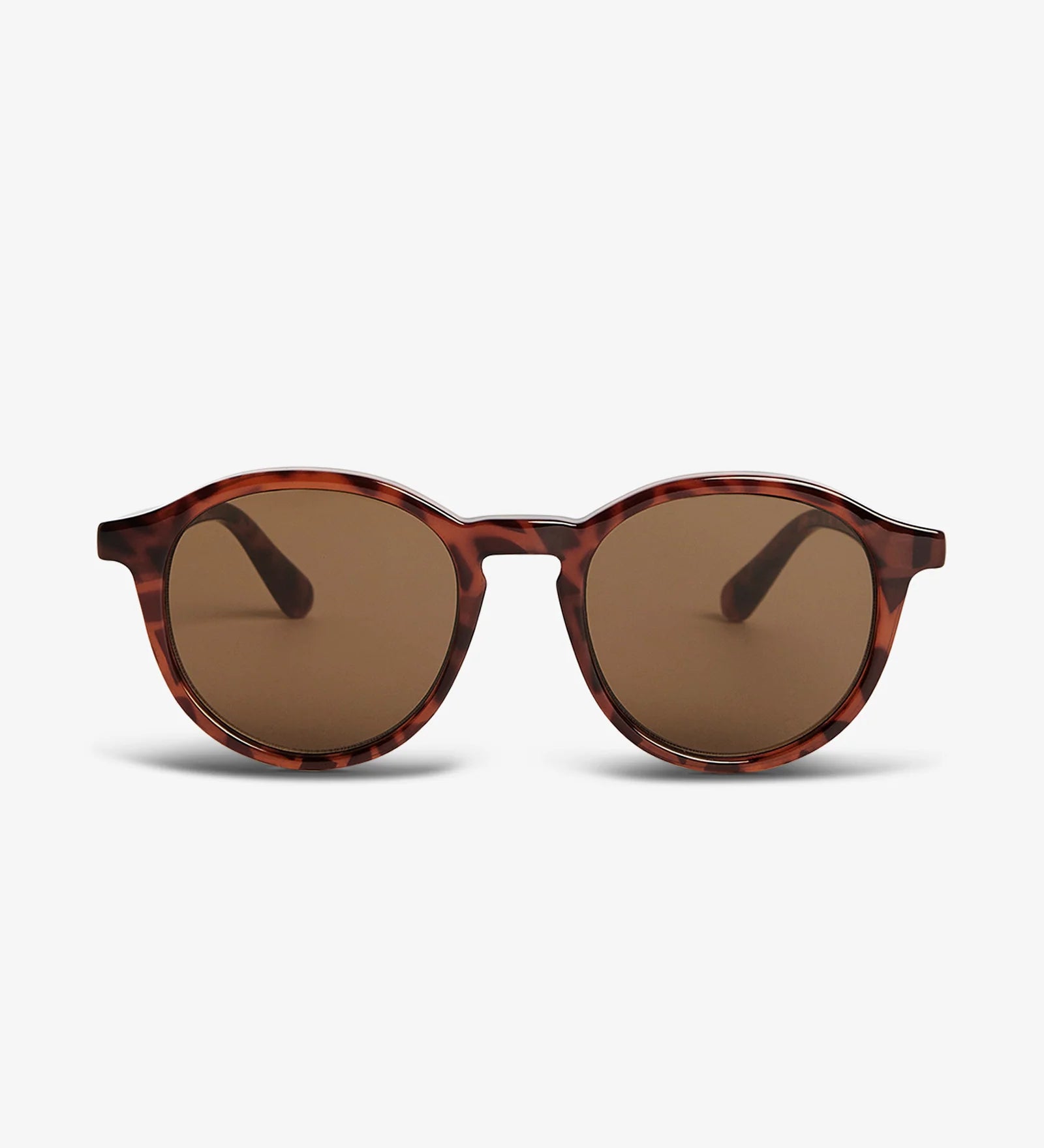 Round sunglasses with tortoiseshell frame and brown lenses on a white background
