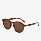 Sunglasses with tortoiseshell frame and brown lenses on a white background