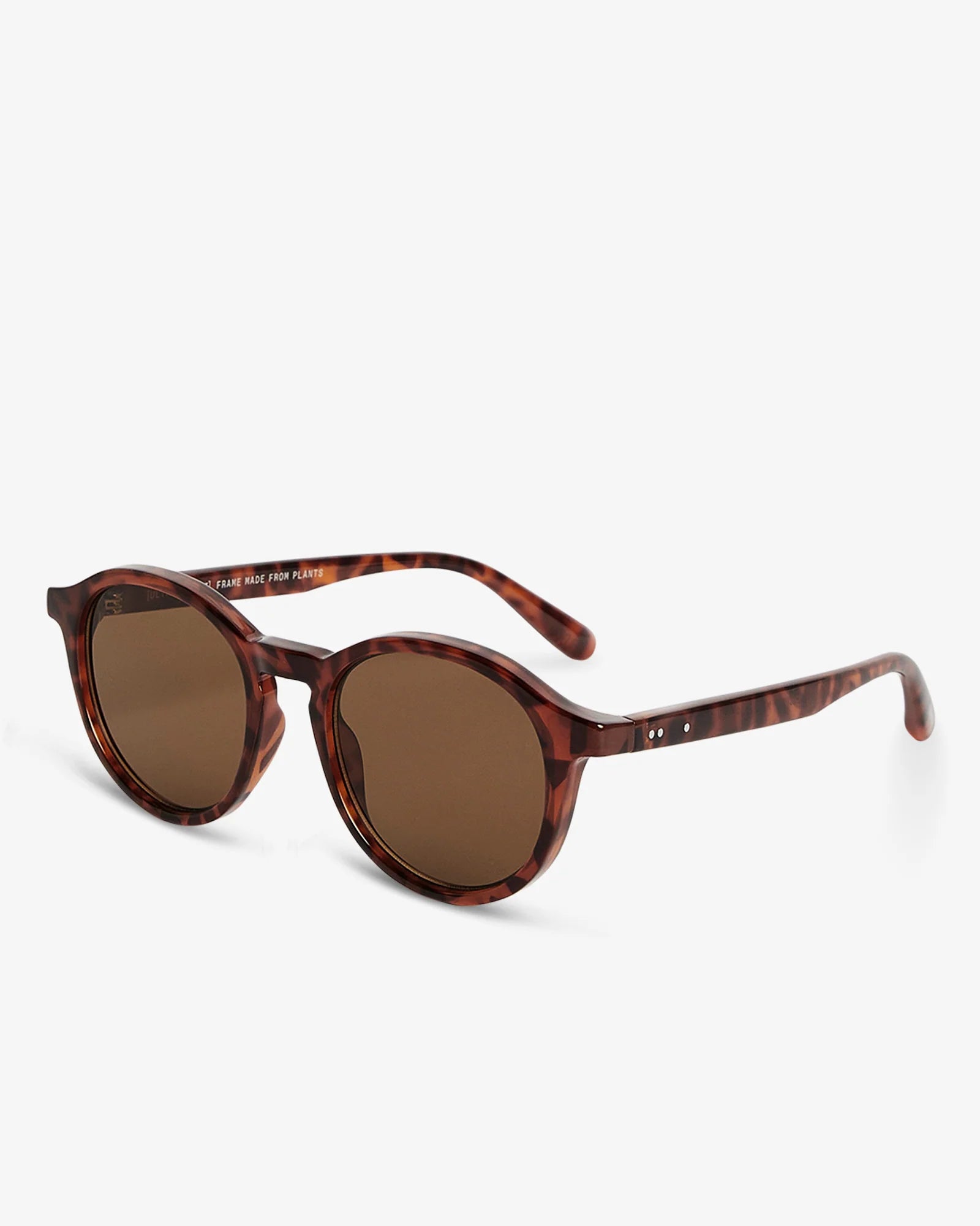 Sunglasses with tortoiseshell frame and brown lenses on a white background
