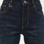 Dark blue jeans on a white background