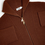 Brown knit jacket with a zipper and 'Léll' brand tag on a white background