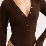 Brown bodysuit with long sleeves on a white background